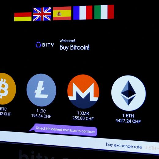 FILE PHOTO: The logos and exchange rates of Bitcoin (BTH), Litecoin (LTC), Monero (XMR) and Ether (ETH) to Swiss franc (CHF) are seen on the display of a cryptocurrency ATM of blockchain payment service provider Bity at the House of Satoshi bitcoin and blockchain shop in Zurich, Switzerland November 4, 2021. REUTERS/Arnd Wiegmann/File Photo