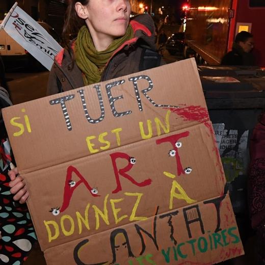 Women from feminist organizations holding photos of late French actress Marie Trintignant and a placard reading "If killing is an art, award Cantat with every victory " (C), demonstrate on March 12, 2018 in front of the Rockstore venue, against a concert of French singer Bertrand Cantat as it takes place in Montpellier, southern France.  Cantat told AFP on March 12, 2018, he was renouncing to perform in summer festivals as he was facing mounting opposition to his concerts, 15 years after his actress girlfriend Marie Trintignant died at his hand. / AFP PHOTO / PASCAL GUYOT