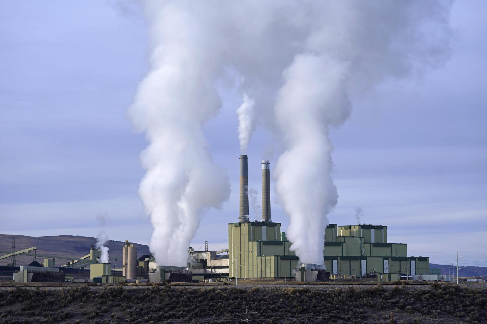 FILE - Steam billows from a coal-fired power plant Nov. 18, 2021, in Craig, Colo. The Supreme Court on Thursday, June 30, 2022, limited how the nation‚Äôs main anti-air pollution law can be used to reduce carbon dioxide emissions from power plants. By a 6-3 vote, with conservatives in the majority, the court said that the Clean Air Act does not give the Environmental Protection Agency broad authority to regulate greenhouse gas emissions from power plants that contribute to global warming. (AP Photo/Rick Bowmer, File)