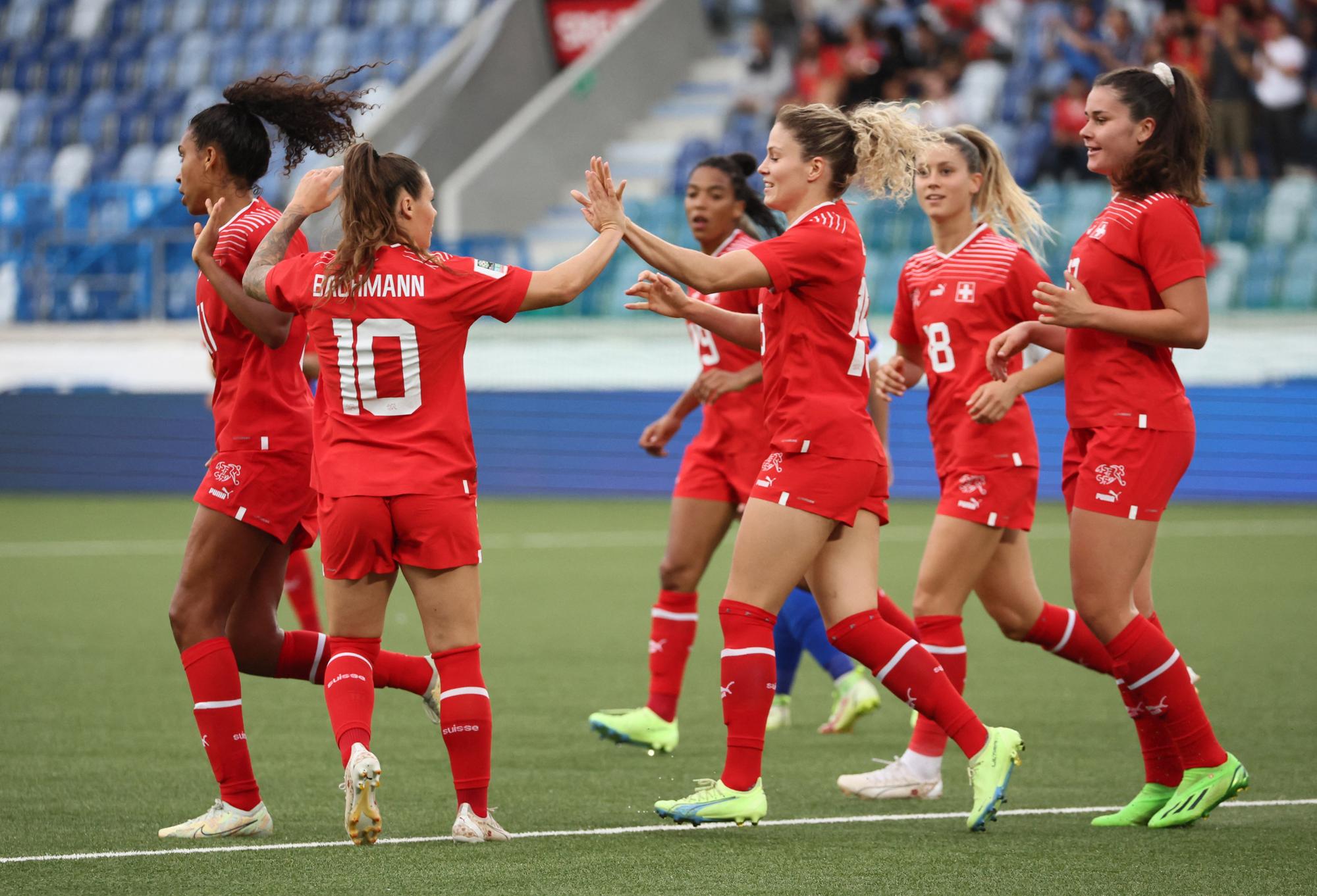 Soccer Football - FIFA Women's World Cup Australia and New Zealand - UEFA Qualifiers - Group G - Switzerland v Moldova - Stade de la Tuiliere, Lausanne, Switzerland - September 6, 2022  Switzerland's Luana Buhler celebrates scoring their fourth goal with Ramona Bachmann and teammates REUTERS/Denis Balibouse
