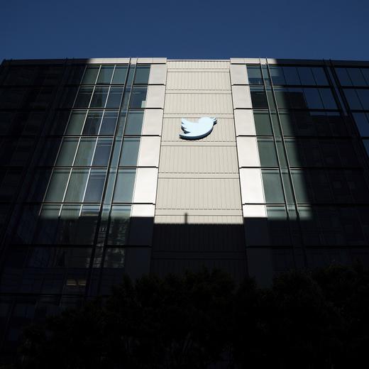 FILE - A Twitter logo hangs outside the company's San Francisco offices on Tuesday, Nov. 1, 2022. Reacting to the tumult and mass layoffs at Twitter under its new owner Elon Musk, a group of Democratic senators on Thursday, Nov. 17, 2022, asked federal regulators to investigate any possible violations by the platform of consumer-protection laws or of its data-security commitments. (AP Photo/Noah Berger, File)