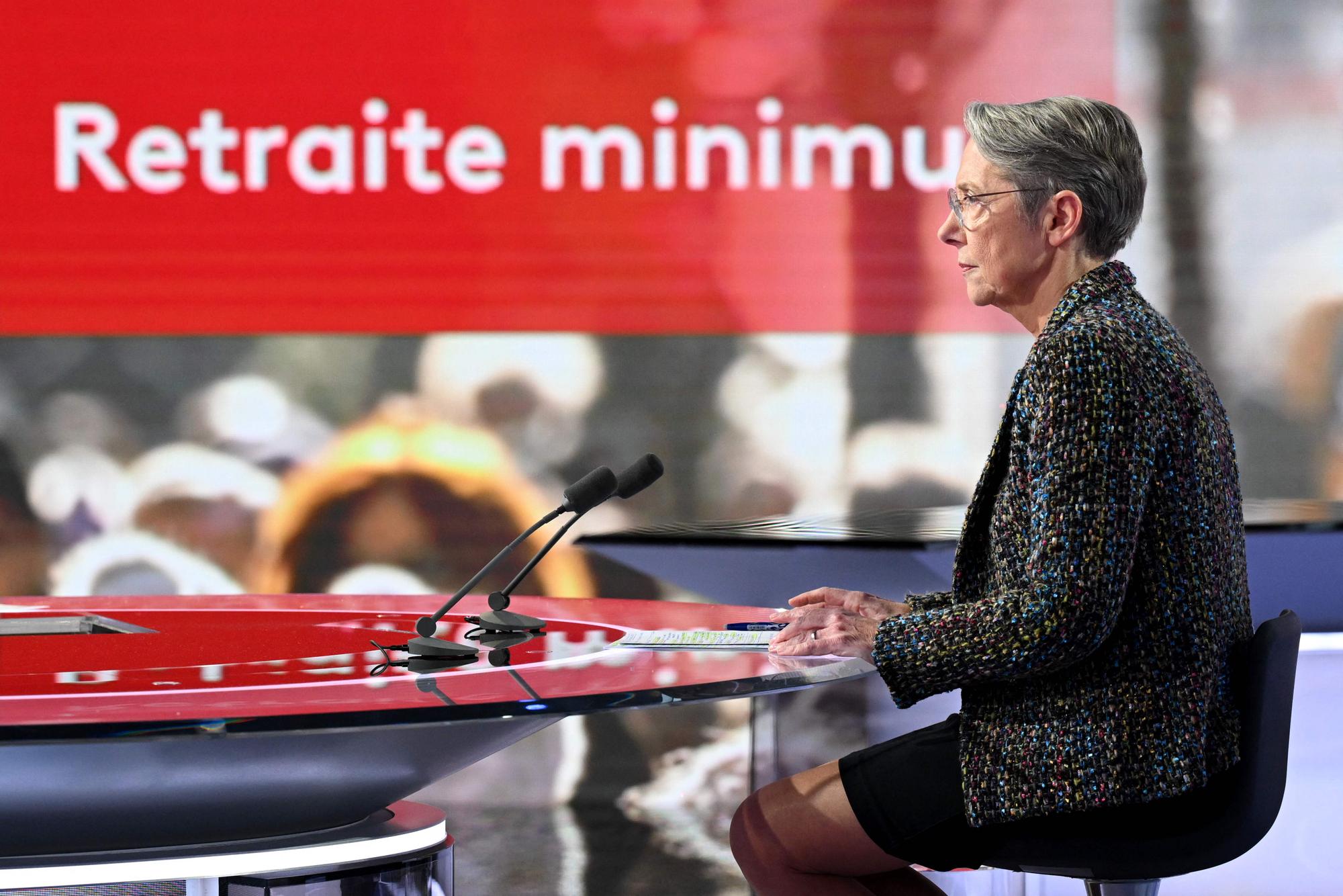 France's Prime Minister Elisabeth Borne takes part in the evening news broadcast of French TV channel France 2 at the France Televisions studios in Paris, on January 10, 2023. (Photo by Bertrand GUAY / AFP)