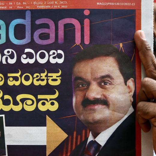 epa10445299 A man reads a newspaper in Bangalore, India, 03 February 2023. In a report published on 24 January, the US-based forensic financial research company Hindenburg Research accused Indian conglomerate Adani Group of stock market manipulation and fraud, which the Adani Group denies. Proceedings at both houses of India's parliament were adjourned on 03 February for the second day as opposition leaders demanded an investigation by a Joint Parliamentary Committee over the allegations against Adani Group. In spite of a rebound in shares, Adani's seven listed firms have lost half their market value since Hindenburg Research's report publication. EPA/JAGADEESH NV