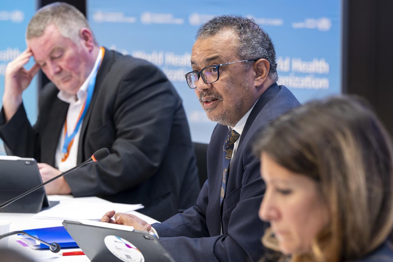 Michael Ryan, left, Executive Director, WHO Health Emergencies Programme, Tedros Adhanom Ghebreyesus, center, Director General of the World Health Organization (WHO), and Maria Van Kerkhove, right, Technical lead Covid 19 WHO Health Emergencies Programme (WHO) speak to journalists during a press conference organized by the Geneva Association of United Nations Correspondents (ACANU) at the World Health Organization (WHO) headquarters in Geneva, Switzerland, Wednesday, December 14, 2022. (KEYSTONE/Martial Trezzini)