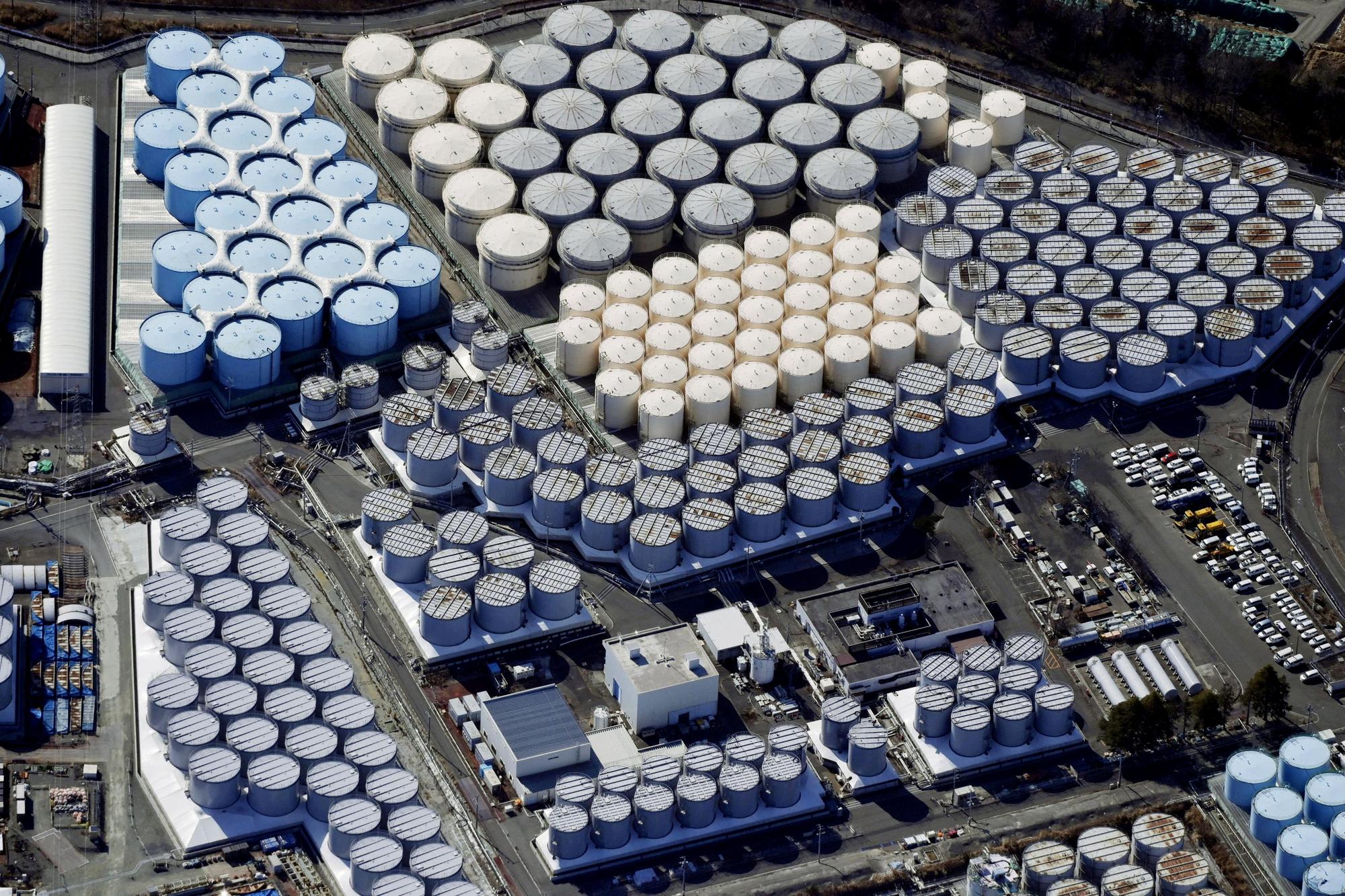 FILE PHOTO: FILE PHOTO: An aerial view shows the storage tanks for treated water at the tsunami-crippled Fukushima Daiichi nuclear power plant in Okuma town, Fukushima prefecture, Japan February 13, 2021, in this photo taken by Kyodo. Picture taken February 13, 2021. Kyodo/via REUTERS ATTENTION EDITORS - THIS IMAGE WAS PROVIDED BY A THIRD PARTY. MANDATORY CREDIT. JAPAN OUT. NO COMMERCIAL OR EDITORIAL SALES IN JAPAN/File Photo/File Photo