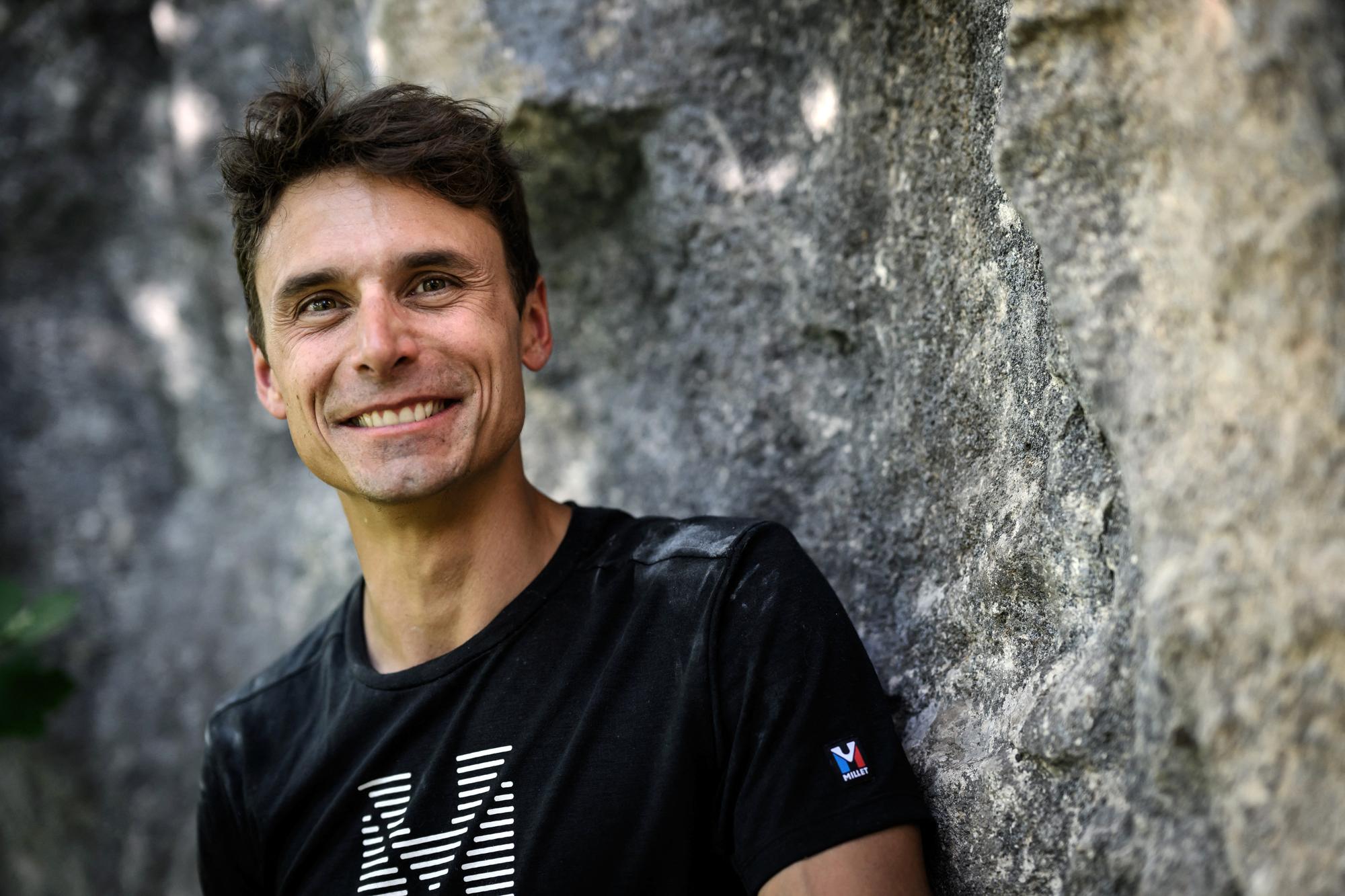 French mountaineer Charles Dubouloz poses after a climbing training session above the Annecy Lake, on June 3, 2022. (Photo by JEFF PACHOUD / AFP)