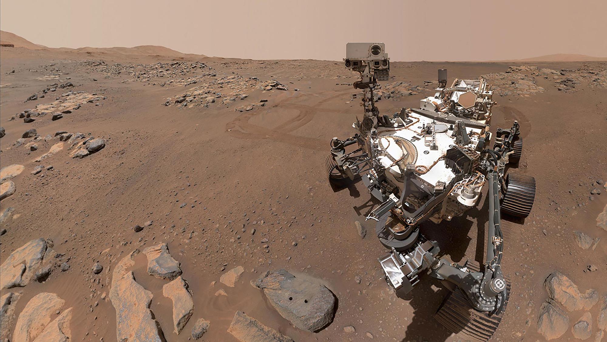 In this image released by NASA, Perseverance Mars rover, using its WATSON camera, took this selfie over a rock nicknamed "Rochette" where two holes can be seen where the rover used its robotic arm to drill rock core samples on September 10, 2021. - The Perseverance rover on Mars collected two probable samples volcanic rock, NASA announced on September 10, 2021, stressing that the presence of salt in these rocks was an indicator of favorable conditions to possibly detect traces of ancient life. (Photo by Handout / various sources / AFP) / RESTRICTED TO EDITORIAL USE - MANDATORY CREDIT "AFP PHOTO / NASA/JPL-Caltech/MSSS" - NO MARKETING - NO ADVERTISING CAMPAIGNS - DISTRIBUTED AS A SERVICE TO CLIENTS
