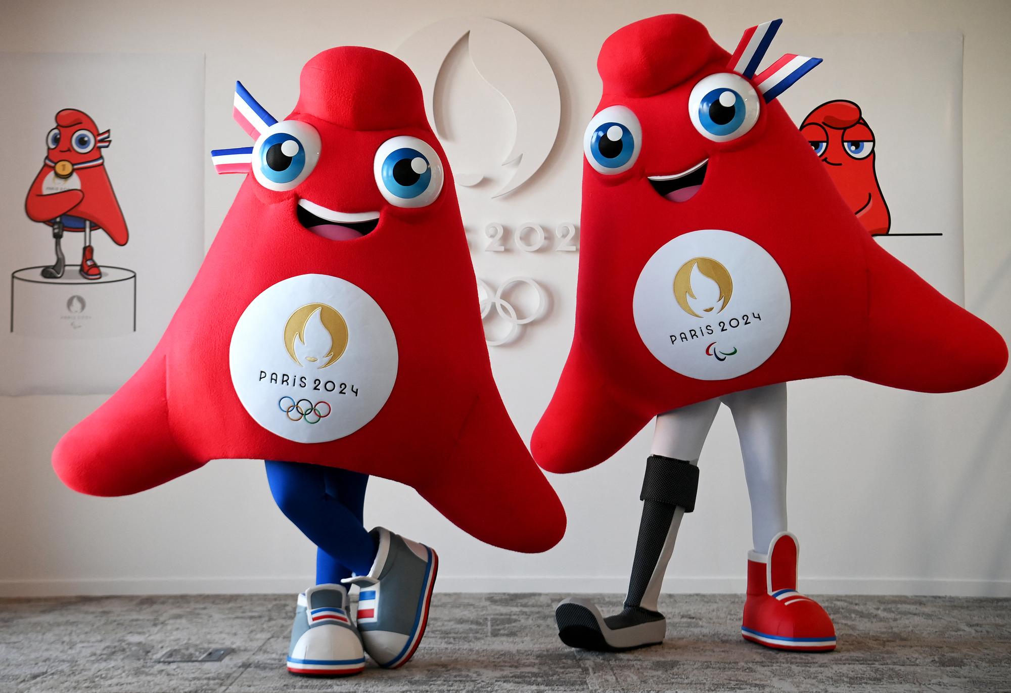 This photograph taken on November 10, 2022, shows the mascots for the Paris 2024 Olympic (L) and Paralympic (R) Games 'Les Phryges' in Saint-Denis, north of Paris. - The name of Paris 2024 Olympic and Paralympic mascots "Les Phryges", representing French revolutionary Phrygian caps, was announced on November 14, 2022. (Photo by FRANCK FIFE / AFP)