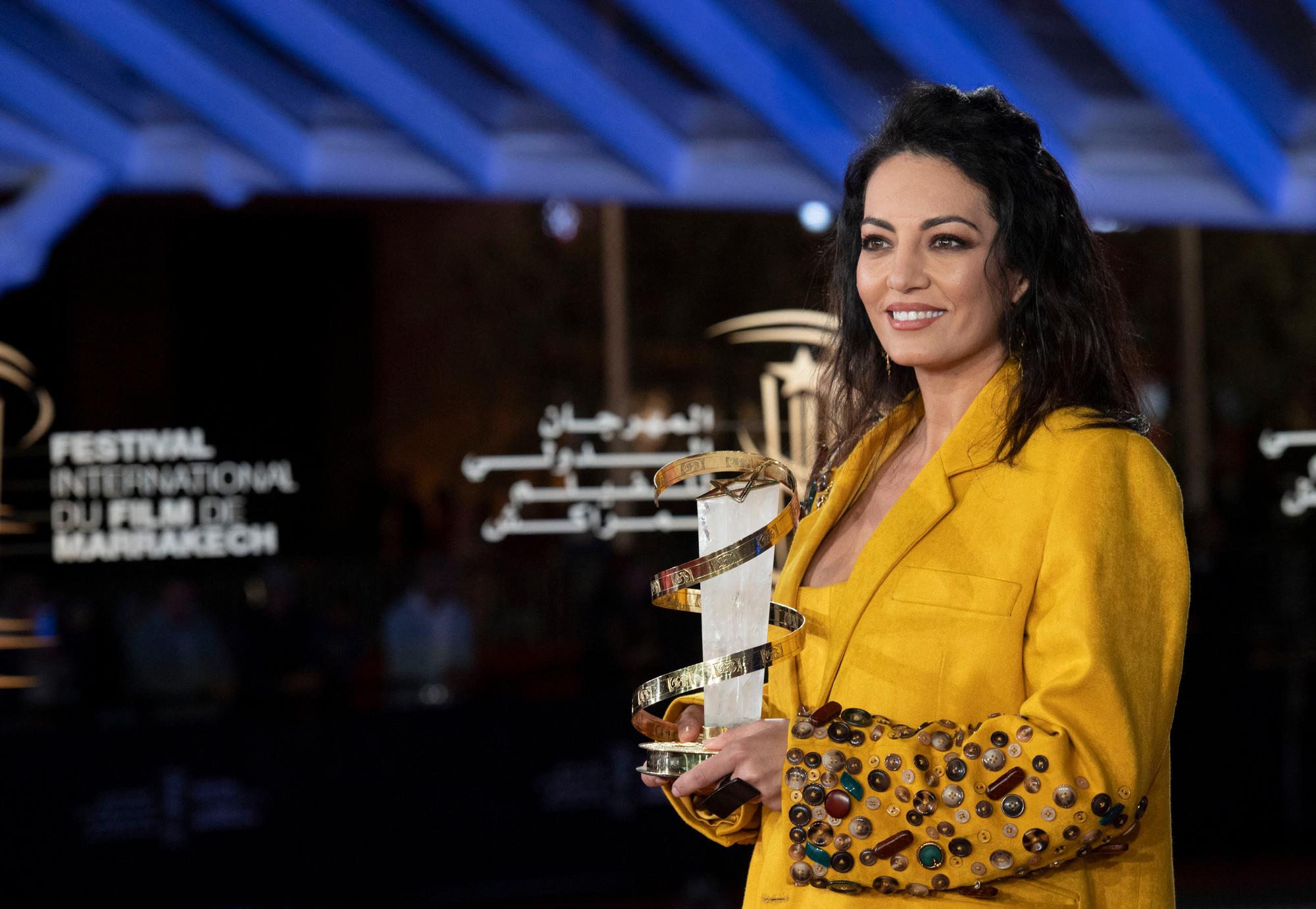 Maroccoan actress and filmaker Maryam Touzani poses with the Jury Prize during the closing ceremony of the 19th Marrakech International Film Festival, on November 19, 2022, in the Moroccan city of Marrakesh. (Photo by JALAL MORCHIDI / AFP)