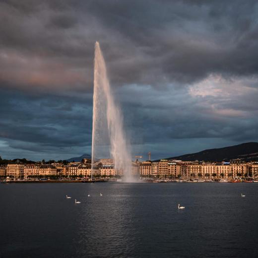 (FILES) This file photo taken on June 14, 2020 shows Geneva's landmark fountain, known as "Jet d'Eau" after sunset in Geneva where Russian leader Vladimir Putin and US President Joe Biden are to meet on June 16 amid the biggest crisis in ties between their two countries in recent history. (Photo by Fabrice COFFRINI / AFP)