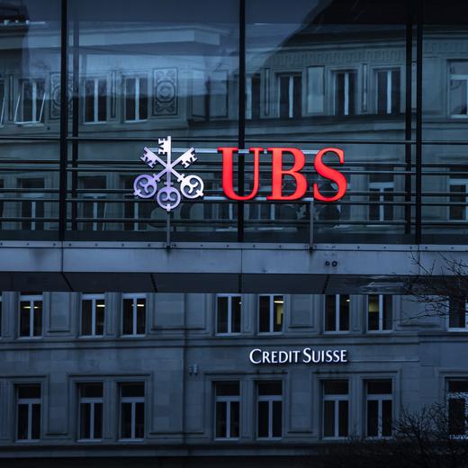 The logos of the Swiss banks Credit Suisse and UBS are displayed on different buildings in Zurich, Switzerland on Sunday March 19, 2023. (KEYSTONE/Michael Buholzer).