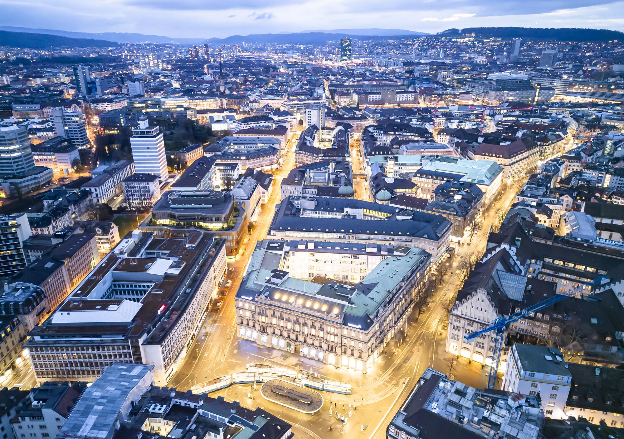epa10532657 An aerial view shows the headquarters of the Swiss banks Credit Suisse (R) and UBS (L), at Paradeplatz in Zurich, Switzerland, 19 March 2023. The bank UBS takes over Credit Suisse for 2 billion US dollars. Shares of Credit Suisse lost more than one-quarter of their value on 15 March 2023, hitting a record low after its biggest shareholder, the Saudi National Bank, told outlets that it would not inject more money into the ailing Swiss bank. EPA/MICHAEL BUHOLZER
