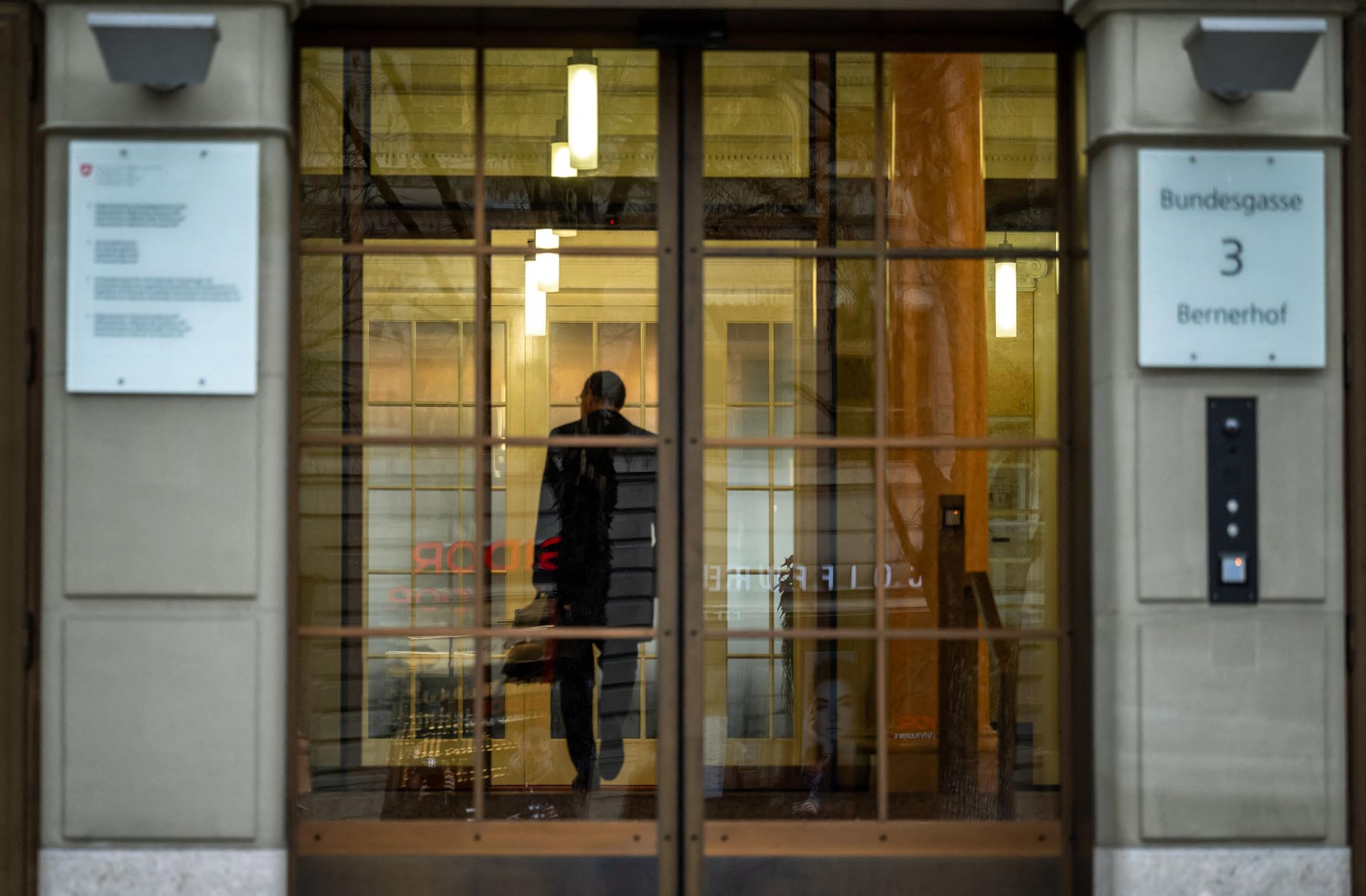 Chairman of the Swiss National Bank (SNB) Thomas Jordan enters the Swiss Federal Department of Finance for talks on Credit Suisse bank crisis, in Bern on March 19, 2023. - UBS was up against the clock on March 19, 2023 in talks to finalise a mammoth takeover of its troubled rival Swiss bank Credit Suisse and reassure investors before the markets reopen. Switzerland's biggest bank UBS is being urged by the authorities to get a deal over the line in a bid to avoid a wave of contagious panic on the markets Monday, according to several media reports. (Photo by Fabrice COFFRINI / AFP)