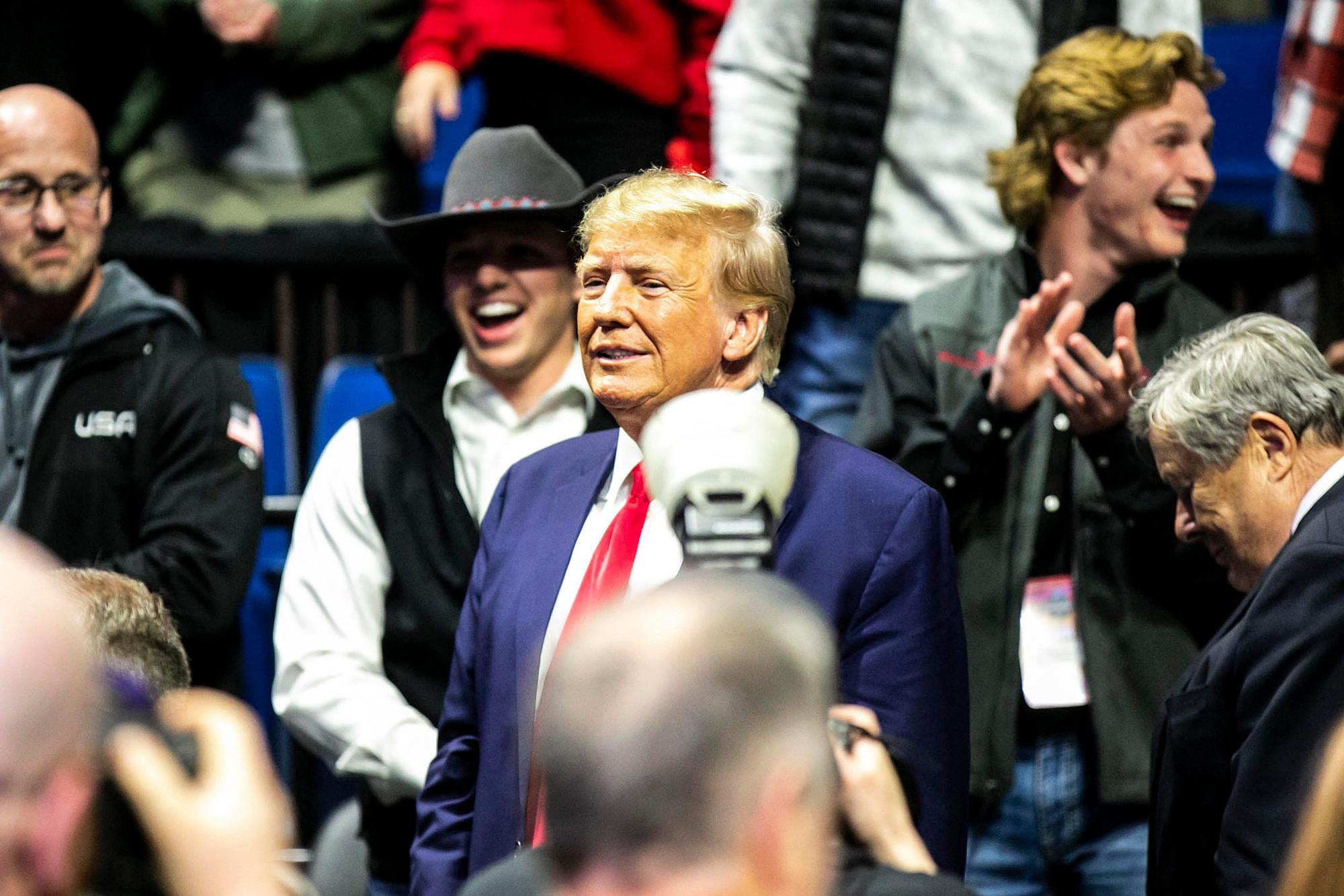 Mar 18, 2023; Tulsa, OK, USA; Former President Donald Trump greets fans as he arrives before the finals during the sixth session of the NCAA Division I Wrestling Championships, Saturday, March 18, 2023, at BOK Center in Tulsa, Okla. Mandatory Credit: Joseph Cress-USA TODAY Sports