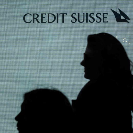 A sign of Credit Suisse bank is seen at their headquarters in Zurich on March 20, 2023. - UBS share price plunged on March 20, 2023 as a deal to take over its troubled Swiss rival Credit Suisse for $3.25 billion failed to calm stock market nerves. (Photo by Fabrice COFFRINI / AFP)