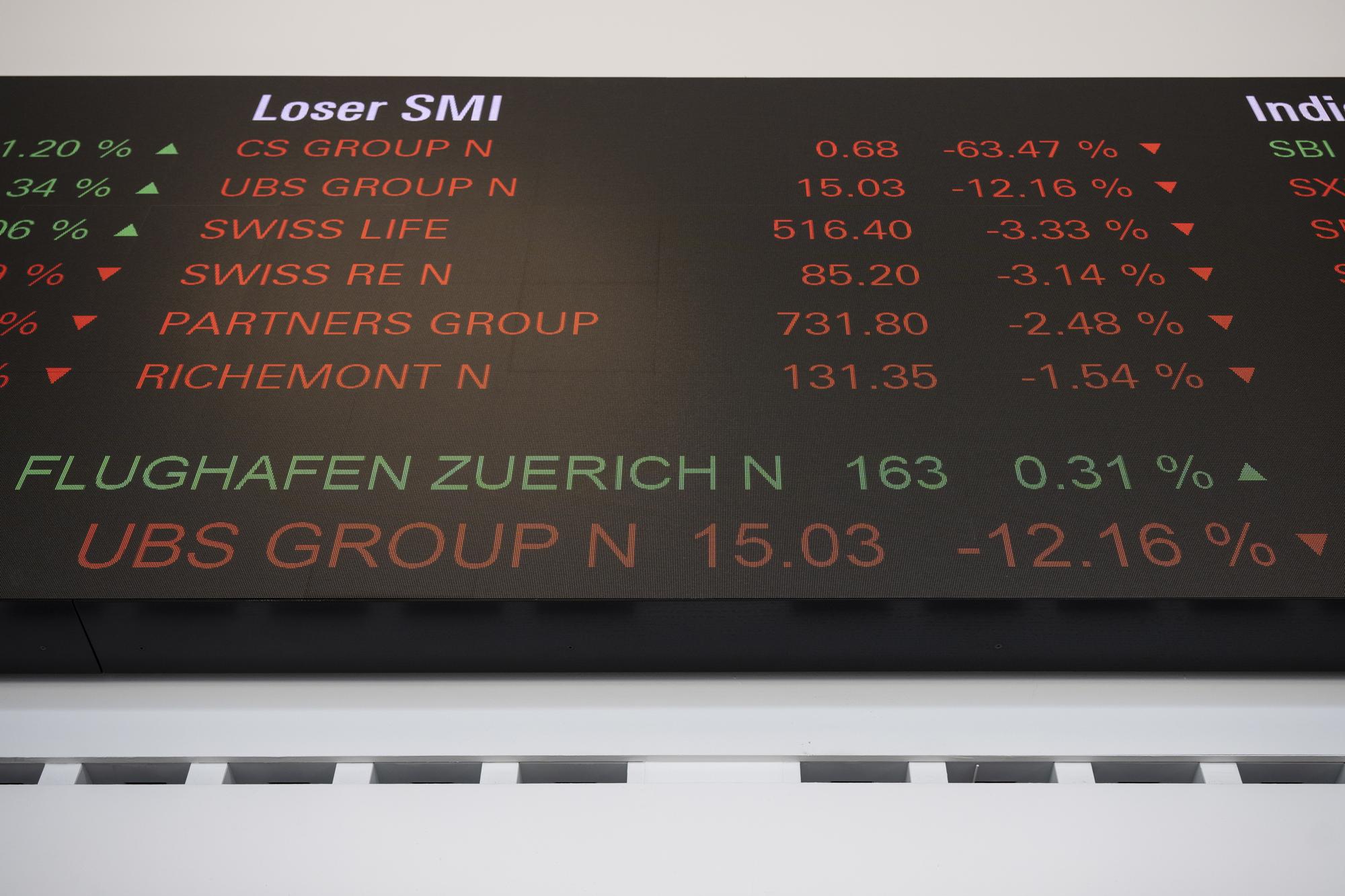 epa10533391 A stock ticker shows the developments on the Credit Suisse and UBS Group stock exchange in Zurich, Switzerland, 20 March 2023. Financial markets are reacting after troubled bank Credit Suisse was rescued in a three billion dollars purchase by its Swiss rival UBS in a government-backed deal. UBS is down 13 percent and other European bank shares have also dropped significantly. EPA/ENNIO LEANZA