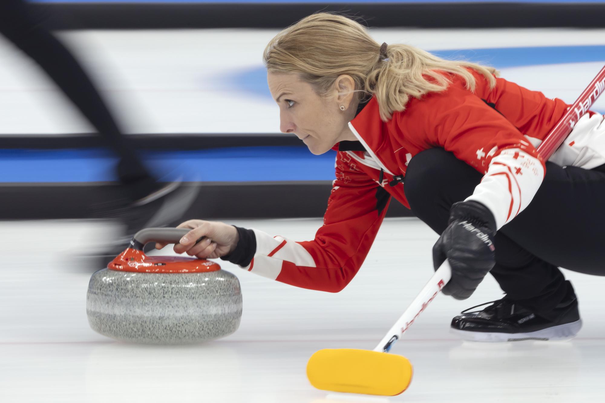 Switzerland skip Silvana Tirinzoni releases her rock during the women's Round Robin game between South Korea and Switzerland at the National Aquatics Centre at the 2022 Olympic Winter Games in Beijing, China, on Wednesday, February 16, 2022. (KEYSTONE/Salvatore Di Nolfi)