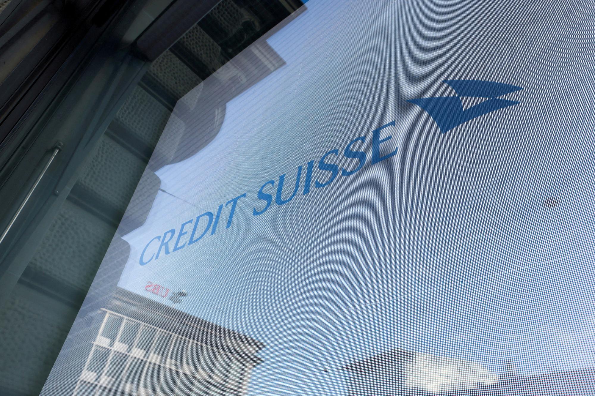 FILE PHOTO: Logos of Swiss banks UBS and Credit Suisse are seen in Zurich, Switzerland March 20, 2023. REUTERS/Denis Balibouse/File Photo