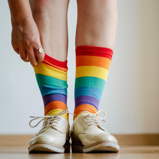 Close up of woman wearing rainbow socks