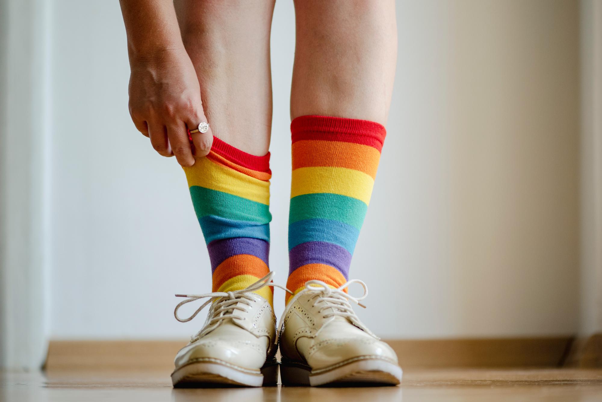 Close up of woman wearing rainbow socks