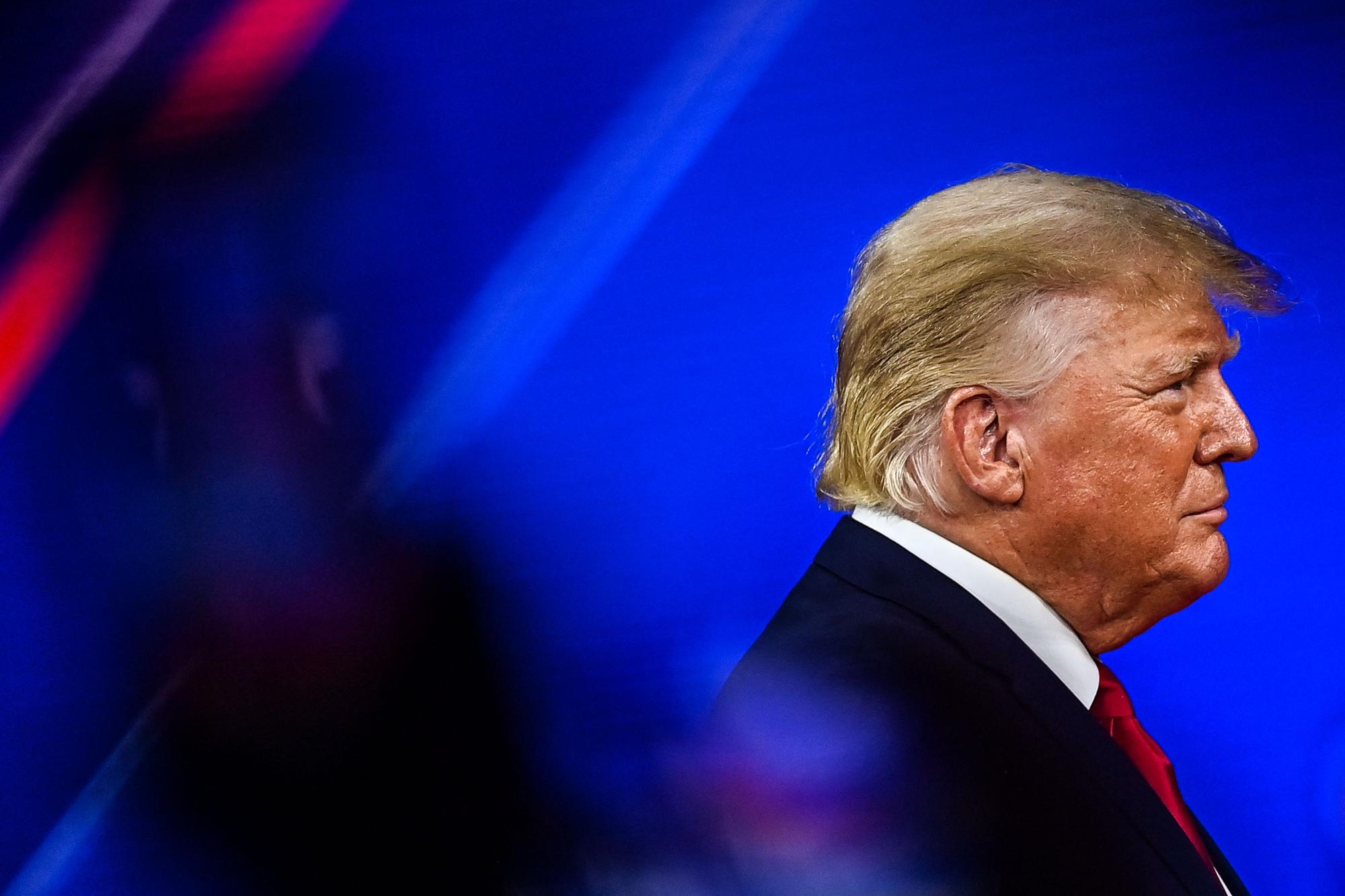 (FILES) In this file photo taken on February 26, 2022 Former US President Donald Trump arrives to speak at the Conservative Political Action Conference 2022 (CPAC) in Orlando, Florida. - A New York grand jury on March 30, 2023, indicted Donald Trump over hush money payments made to a porn star during his 2016 campaign, making him the first former US president to face criminal charges. (Photo by CHANDAN KHANNA / AFP)