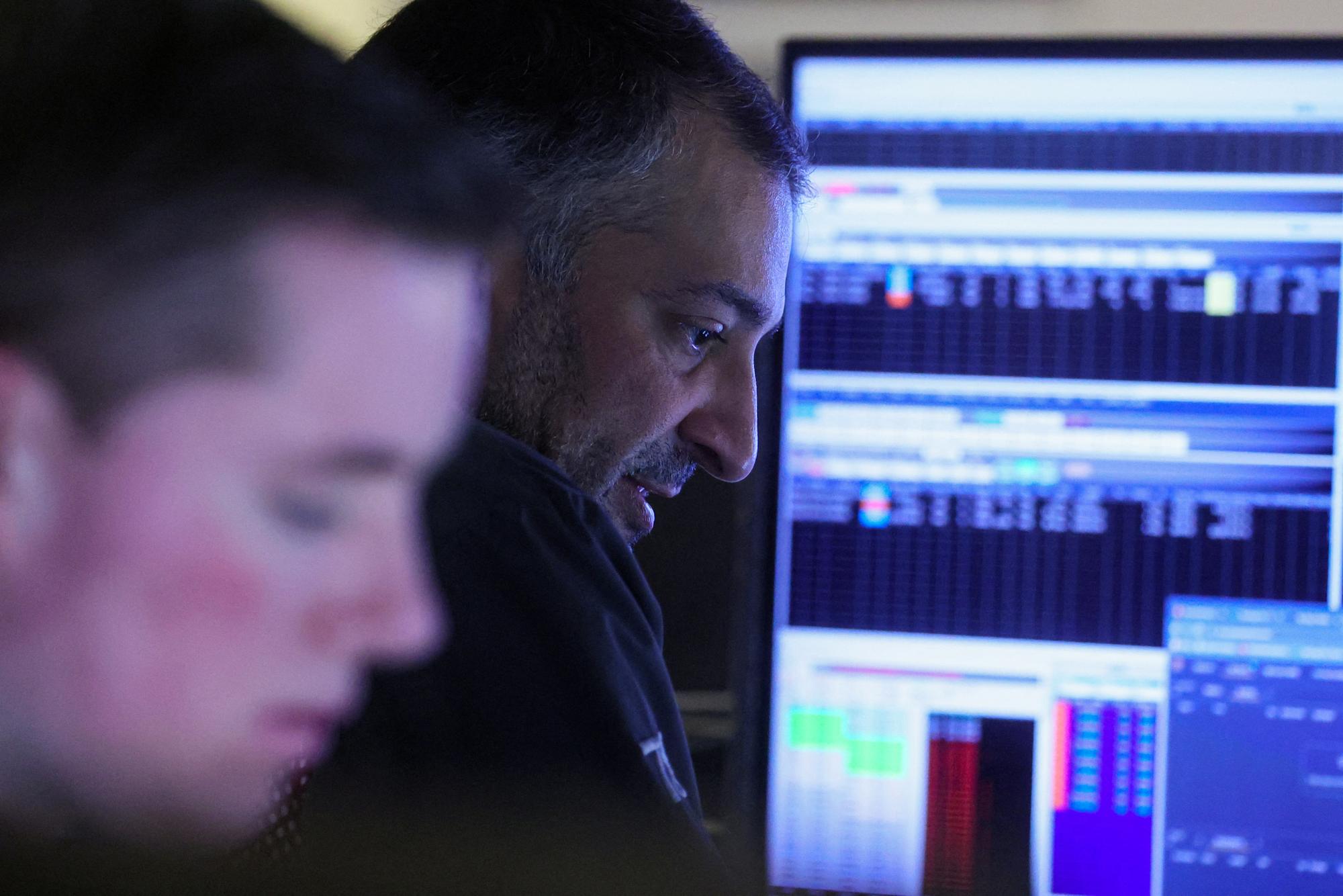 Traders work on the floor of the New York Stock Exchange (NYSE) in New York City, U.S., April 10, 2023. REUTERS/Brendan McDermid