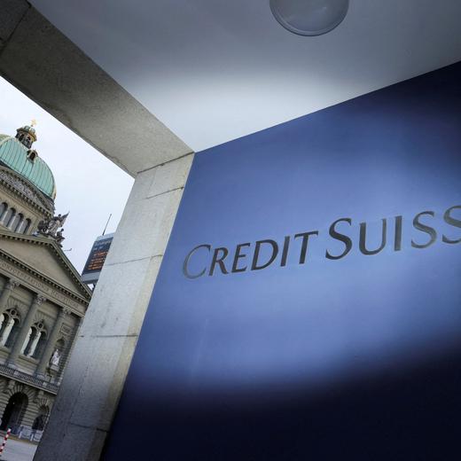 FILE PHOTO: The logo of Credit Suisse is pictured in front of the Swiss Parliament Building, in Bern, Switzerland, March 19, 2023. REUTERS/Denis Balibouse/File Photo