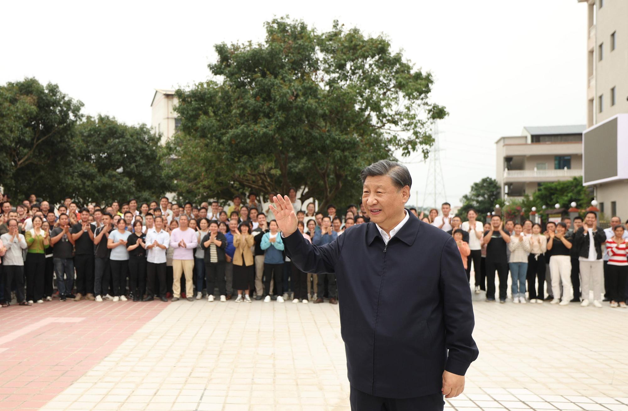 230412 -- GUANGZHOU, April 12, 2023 -- Chinese President Xi Jinping, also general secretary of the Communist Party of China Central Committee and chairman of the Central Military Commission, talks with villagers at a village in Genzi Township, Gaozhou City of Maoming, south China s Guangdong Province, April 11, 2023. Xi visited a lychee orchard and a longan and lychee cooperative at the village to learn about local efforts to develop distinctive planting industry and advance rural revitalization. CHINA-GUANGDONG-MAOMING-XI JINPING-INSPECTION CN JuxPeng PUBLICATIONxNOTxINxCHN