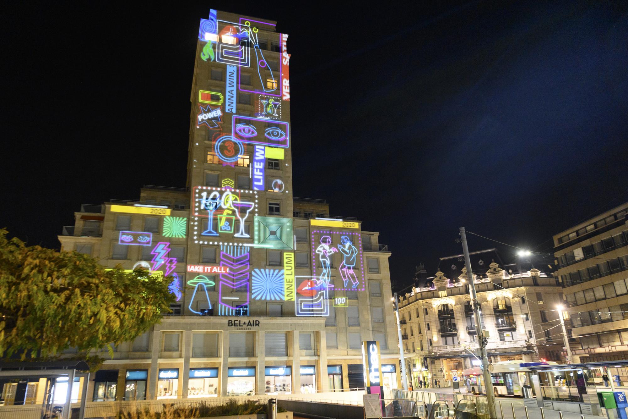 An light projection by students of the Swiss art school ECAL Ecole cantonale d'art de Lausanne is pictured on the Tour Bel-Air ahead of the Lausanne Light Festival (Festival Lausanne Lumieres), in Lausanne, Switzerland, Monday, November 23, 2020. 8 projections on different buildings aiming to showcase the city of Lausanne under a new light will be on display during the festival that lasts from November 24 to December 24. (KEYSTONE/Laurent Gillieron)