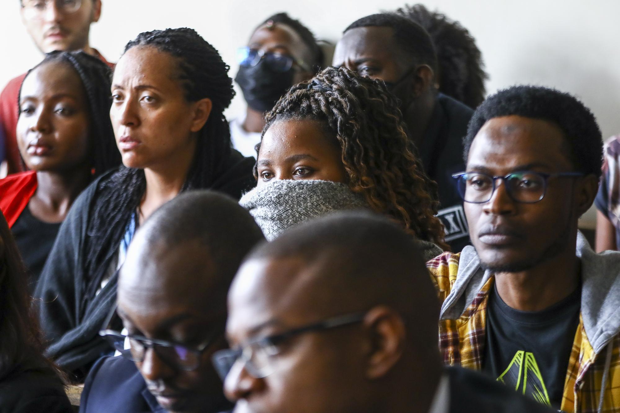 epa10569493 Some of the Facebook content moderators who have sued Meta over unfair dismissal, cover their faces during a court session, at the Milimani Commercial Courts in Nairobi, Kenya, 12 April 2023. Facebook content moderators in Kenya, who worked for outsourcing company Sama, that is contracted to moderate Facebook content, are suing US company Meta over what they claim was unlawful dismissal. EPA/Daniel Irungu