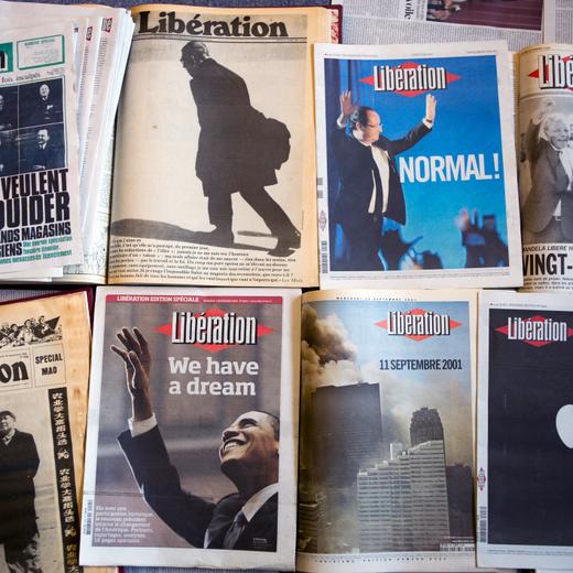 A picture taken in Paris on September 9, 2013 shows the frontpages of the French daily Liberation over the years. AFP PHOTO / FRED DUFOUR (Photo by FRED DUFOUR / AFP)