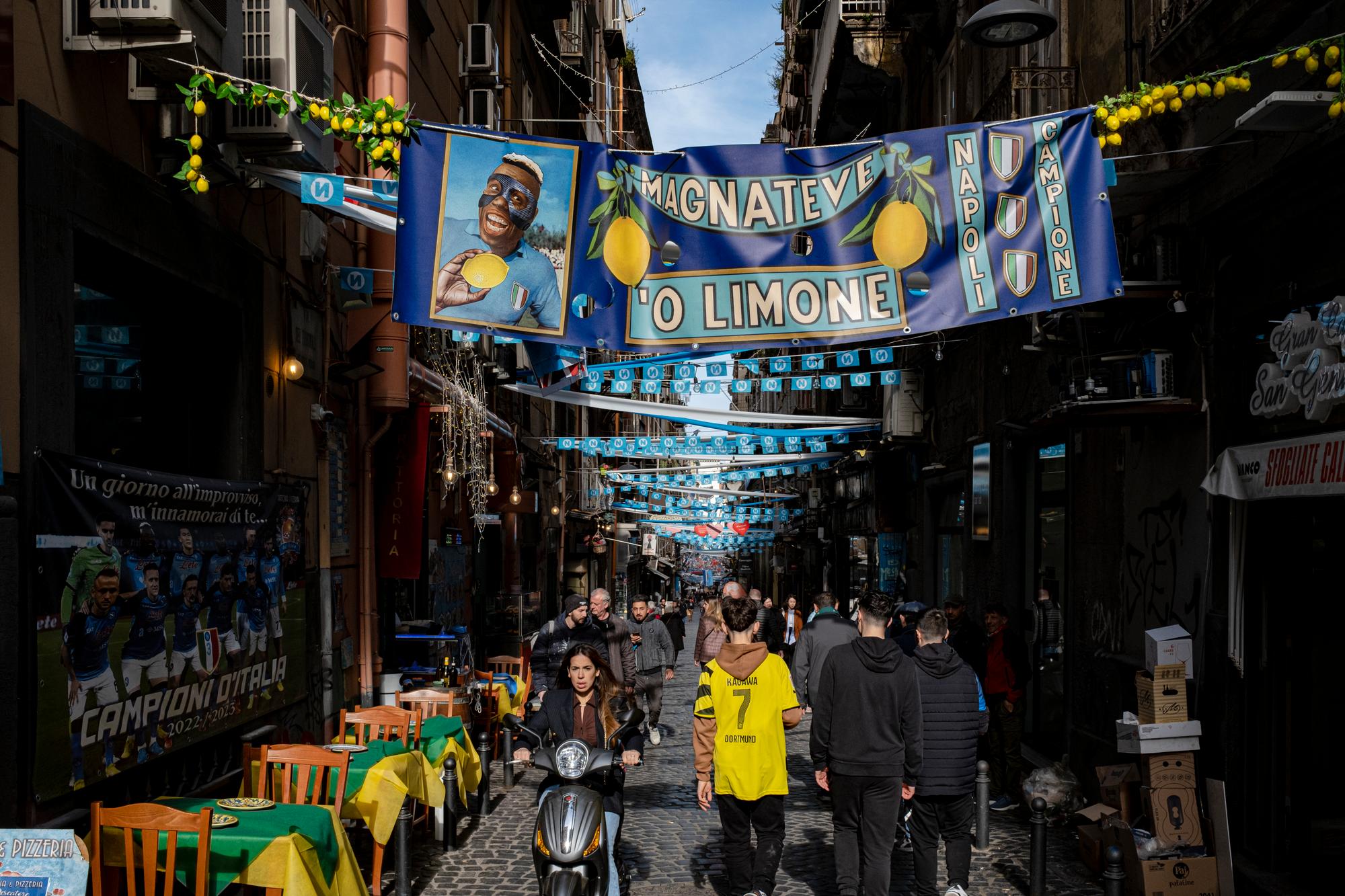 30 March 2023, Naples, Italy - Light blue festoons and bunners installed in the street of naples where preparations began for weeks to celebrate the third championship of the SSC Napoli club after 33 years (1990).