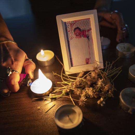 epa10591650 An activist lights candles for death row inmate Tangaraju Suppiah during a vigil for him at a private office in Singapore, 26 April 2023. Suppiah was executed on 26 April 2023 according to the local anti-death penalty advocacy group the Transformative Justice Collective (TJC), in the country?s first capital punishment carried out in the year. Tangaraju was convicted for abetting an attempt to traffic one kilogram of cannabis in 2013. The case has reignited debate in the city state on capital punishment amid concerns by activists on the fairness of his trial and conviction. EPA/HOW HWEE YOUNG