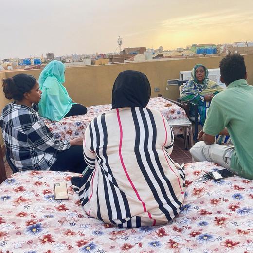 Heba and her family members sit on the roof-top of their house during the conflict in Khartoum, Sudan, April 30, 2023. REUTERS/Stringer