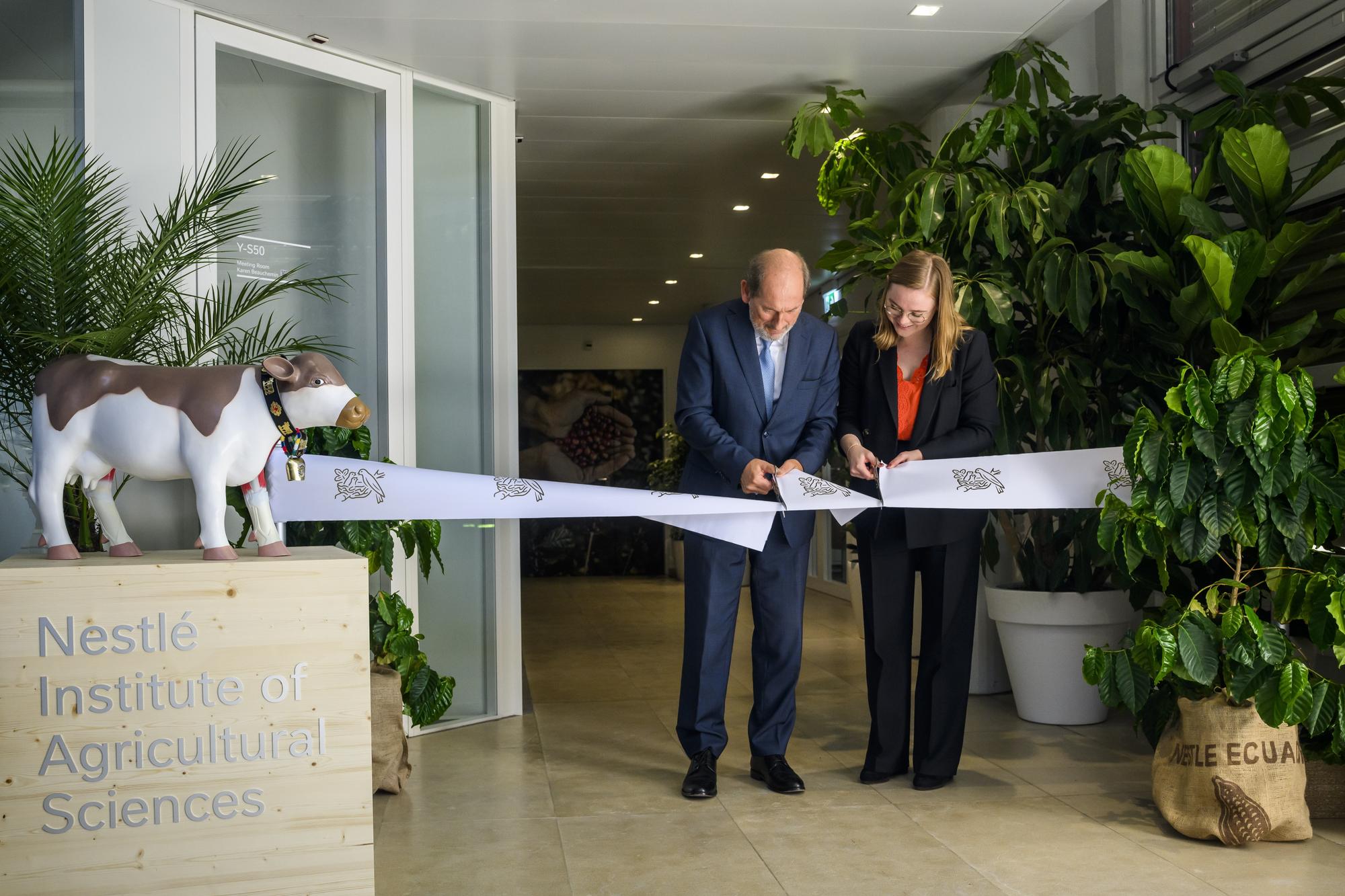 epa10606395 Paul Bulcke (L), Nestle Chairman and Valerie Dittli (R), State Councillor of the Canton of Vaud, cut the ribbon during the inauguration of Nestle Institute of Agricultural Sciences, in Vers-chez-les-Blanc, near Lausanne, Switzerland, 03 May 2023.