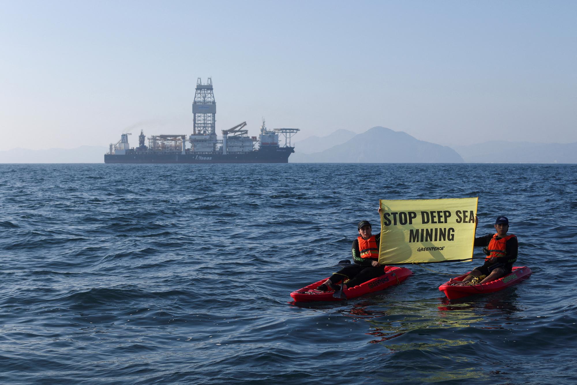FILE PHOTO: Greenpeace activists from New Zealand and Mexico confront the deep sea mining vessel Hidden Gem, commissioned by Canadian miner The Metals Company, as it returned to port from eight weeks of test mining in the Clarion-Clipperton Zone between Mexico and Hawaii, off the coast of Manzanillo, Mexico November 16, 2022. REUTERS/Gustavo Graf/File Photo