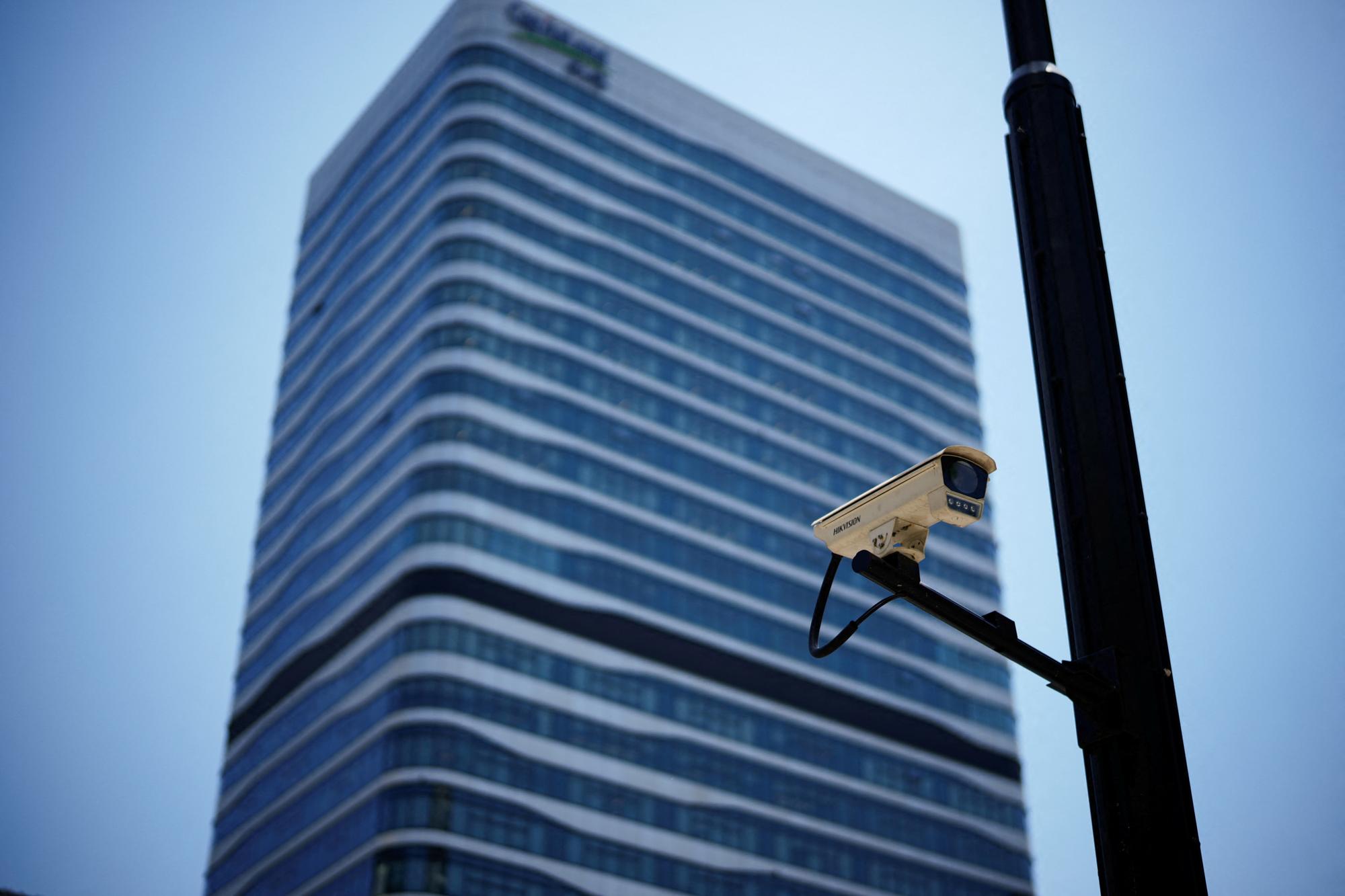 A surveillance camera is seen in front of an office building, where the office of Capvision is located, in Shanghai, China, May 9, 2023. REUTERS/Aly Song