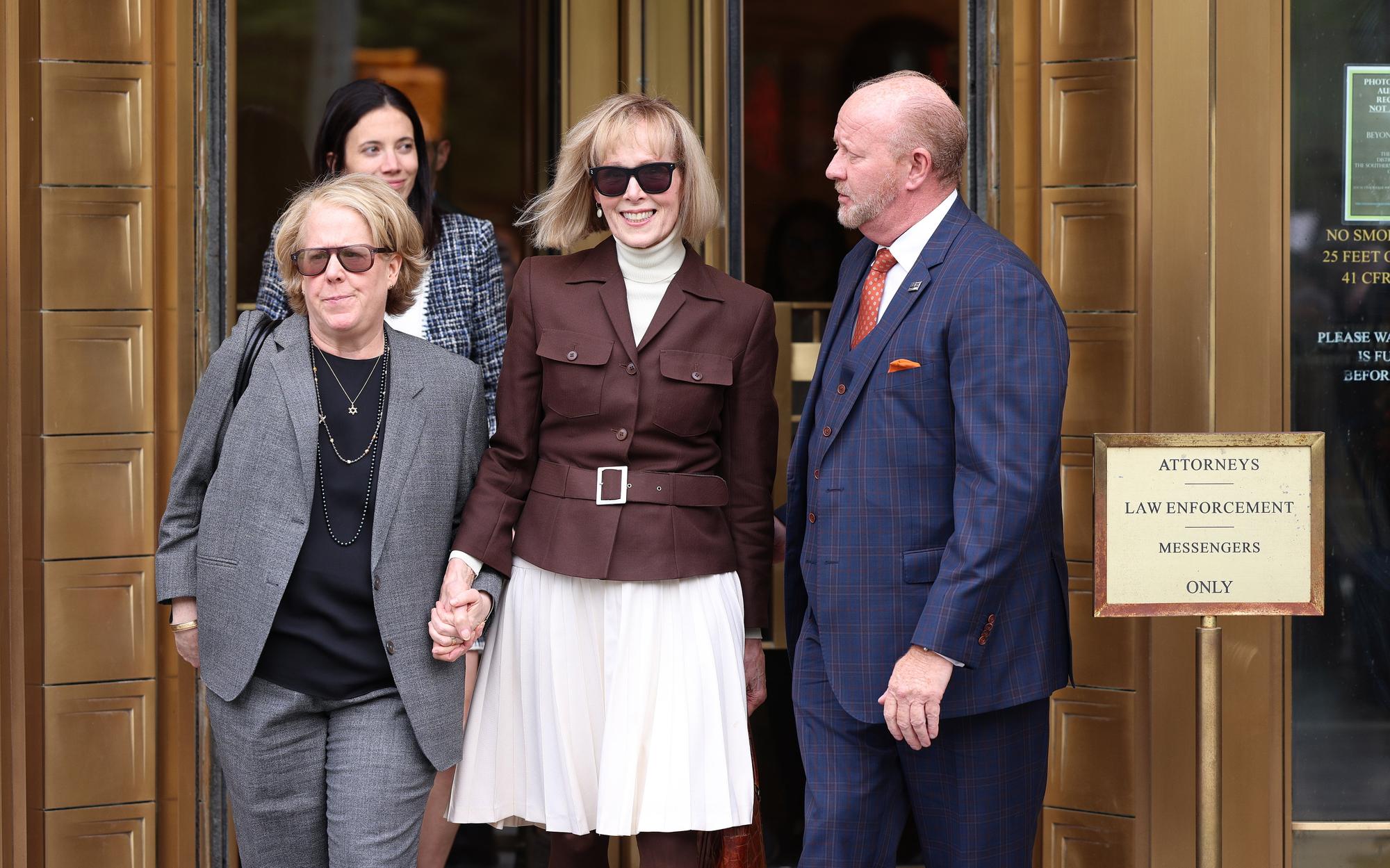 epaselect epa10618125 E. Jean Carroll (C) leaves a federal court house after the jury found that former president Donald J. Trump was liable for sexually abusing and defaming her but not liable for raping her in the sexual assault and defamation civil lawsuit Carroll had brought against him in New York, New York, USA, 09 May 2023. Carroll alleges that Trump raped her in the dressing room of a New York department store in the 1990s and the jury in its verdict awarded her $5 million USD (4.5 million euro) for damages. EPA/JUSTIN LANE