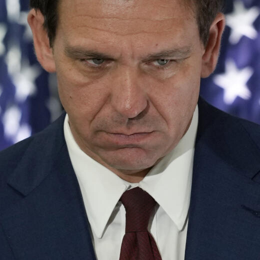 Florida Governor Ron DeSantis listens to a speaker during a news conference to sign several bills related to public education and increases in teacher pay, in Miami, Tuesday, May 9, 2023. (AP Photo/Rebecca Blackwell)