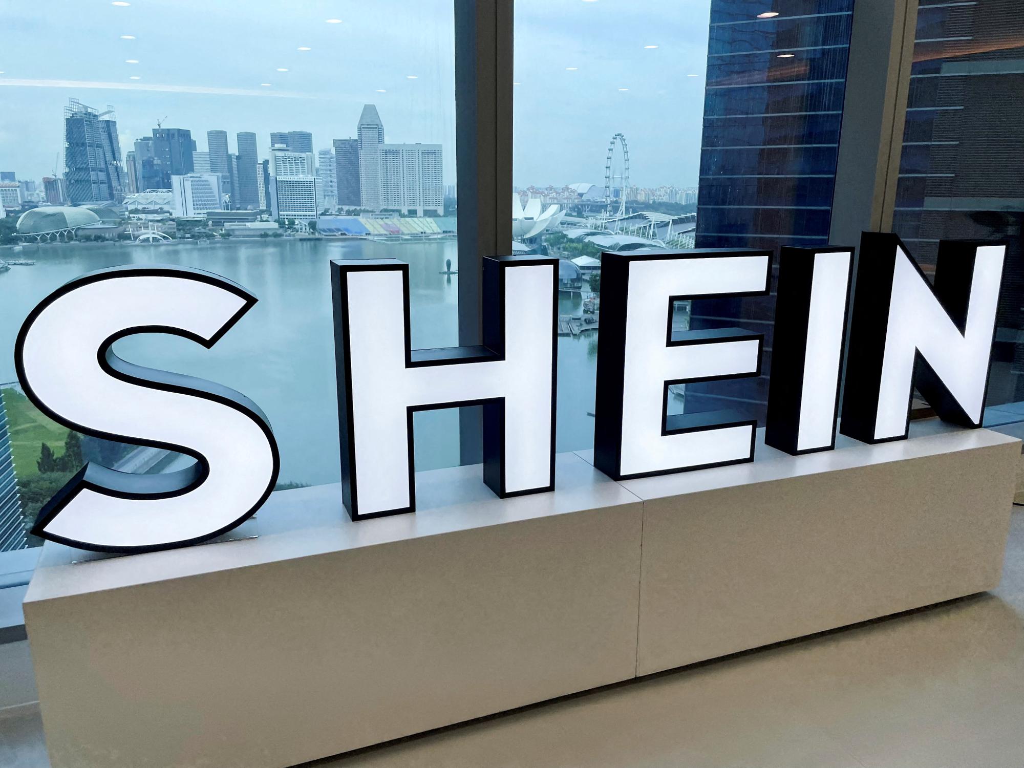FILE PHOTO: A Shein logo is pictured at the company's office in the central business district of Singapore, October 18, 2022. REUTERS/Chen Lin/File Photo