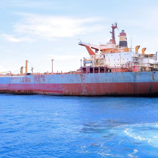 This picture taken on May 30, 2023 shows the beleaguered FSO Safer oil tanker in the Red Sea, off the coast of Yemen's rebel-held Rass Issa port in the western Hodeida province. The United Nations said on May 30 it was ready to start salvage work on the stranded vessel with more than one million barrels of crude that pose an acute risk to the environment with the possibility of it breaking apart, exploding or catching fire, according to experts. The 47-year-old ship has not been serviced since Yemen's civil war broke out in 2015 and was left abandoned off the rebel-held port of Hodeida, a critical gateway for shipments into the country heavily dependent on foreign aid. (Photo by AFP)