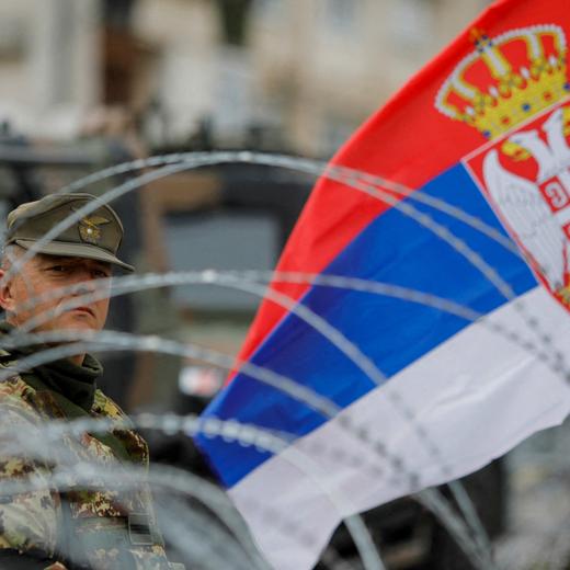 An Italian member of the NATO-led Kosovo Force (KFOR) looks on while standing guard in Leposavic, Kosovo, June 1, 2023. REUTERS/Ognen Teofilovski REFILE - QUALITY REPEAT TPX IMAGES OF THE DAY