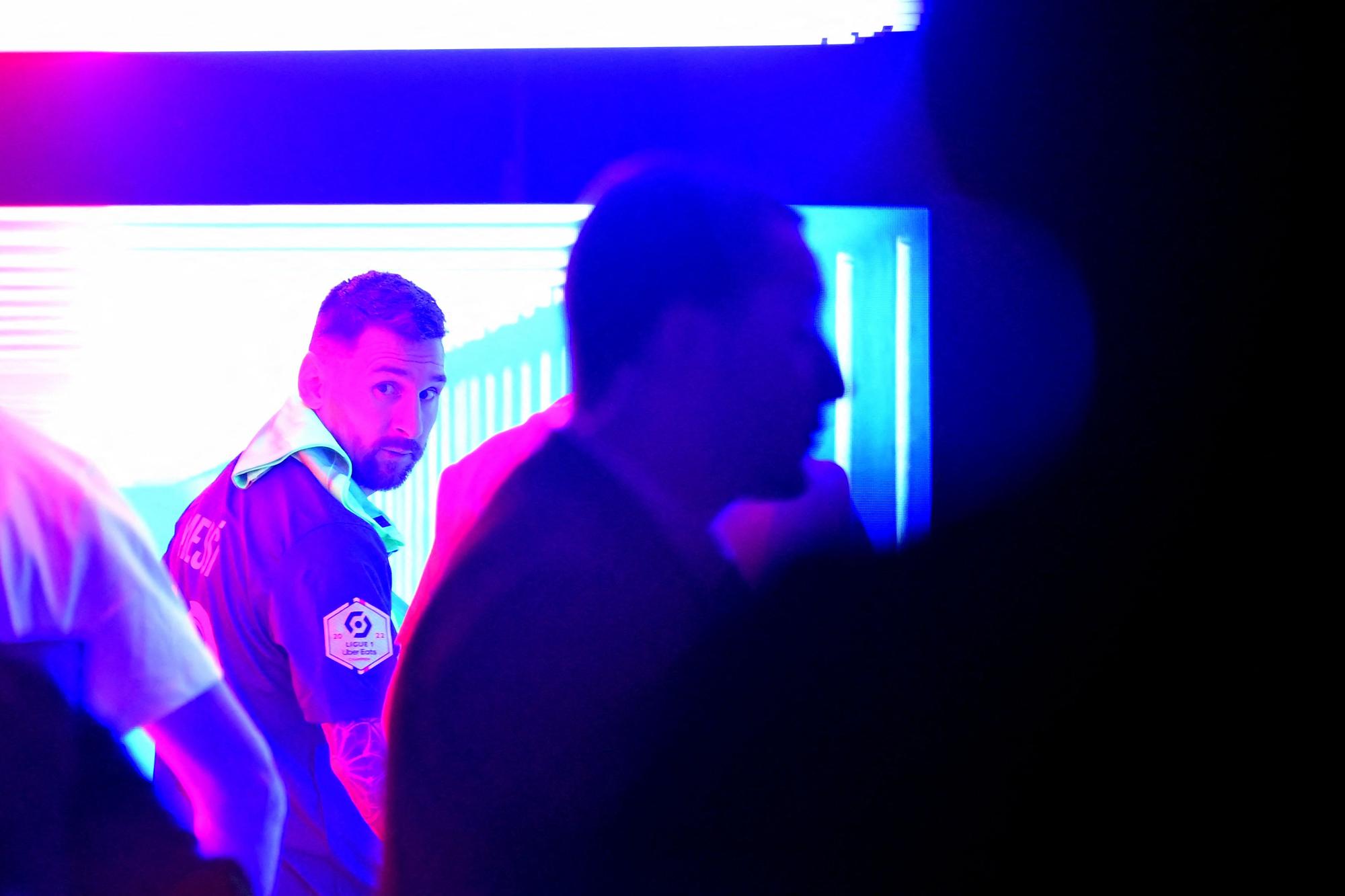 Paris Saint-Germain's Argentine forward Lionel Messi leaves as he walks in the corridor after celebrating team's French L1 2022-2023 championship following the L1 football match between Paris Saint-Germain (PSG) and Clermont Foot 63 at the Parc des Princes Stadium in Paris on June 3, 2023. (Photo by FRANCK FIFE / AFP)