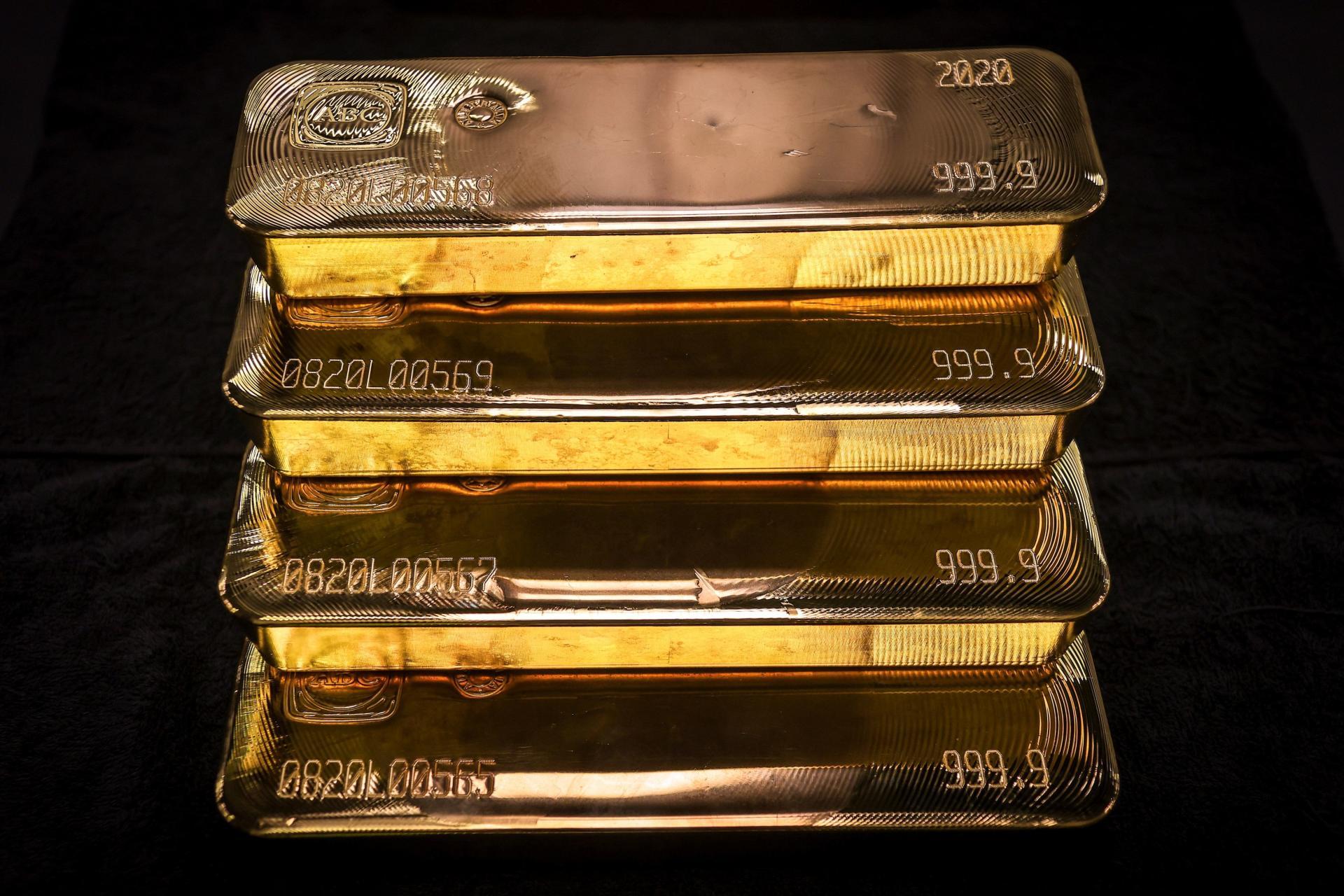 Gold bullion bars are pictured after being inspected and polished at the ABC Refinery in Sydney on August 5, 2020. - Gold prices hit 2,000 USD an ounce on markets for the first time on August 4, the latest surge in a commodity seen as a refuge amid…