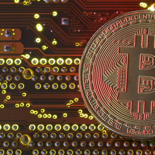FILE PHOTO: A copy of bitcoin standing on PC motherboard is seen in this illustration picture, October 26, 2017. REUTERS/Dado Ruvic/File Photo