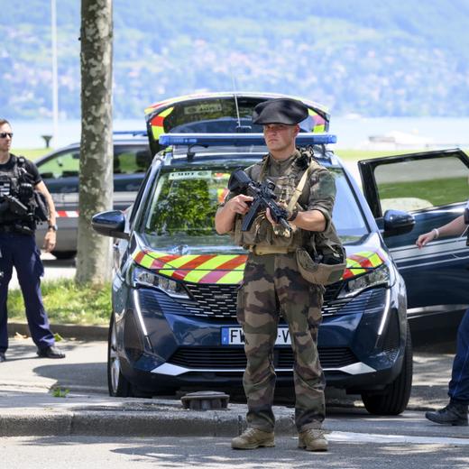 epa10679473 Police gather at a cordoned-off area following a knife attack in Annecy, France, 08 June 2023. The Prefecture of Haute-Savoie confirmed on 08 June that a man had carried out an attack in the Paquier d'Annecy park area, injuring at least six people who were taken to hospital, including four children. EPA/JEAN-CHRISTOPHE BOTT