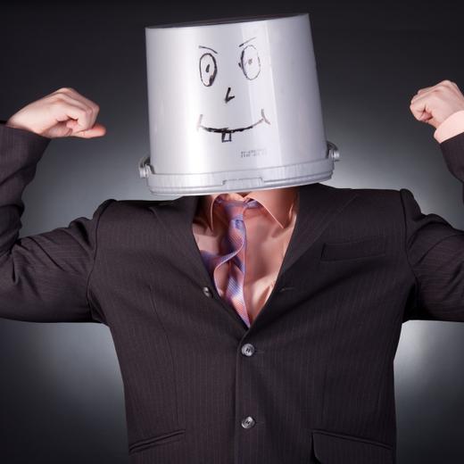 funny businessman with a bucket on his head