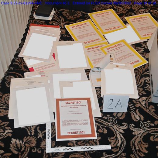 (FILES) This undated image released by the US Department of Justice, shows a photo attached as evidence to a court filing by the US District Court Southern District of Florida, of documents allegedly seized at Mar-a-Lago spread over a carpet. Former US president Donald Trump said June 8, 2023 he has been indicted in the federal probe over his handling of classified documents after leaving office. (Photo by Handout / US DEPARTMENT OF JUSTICE / AFP) / RESTRICTED TO EDITORIAL USE - MANDATORY CREDIT "AFP PHOTO / US Department of Justice"- NO MARKETING NO ADVERTISING CAMPAIGNS - DISTRIBUTED AS A SERVICE TO CLIENTS