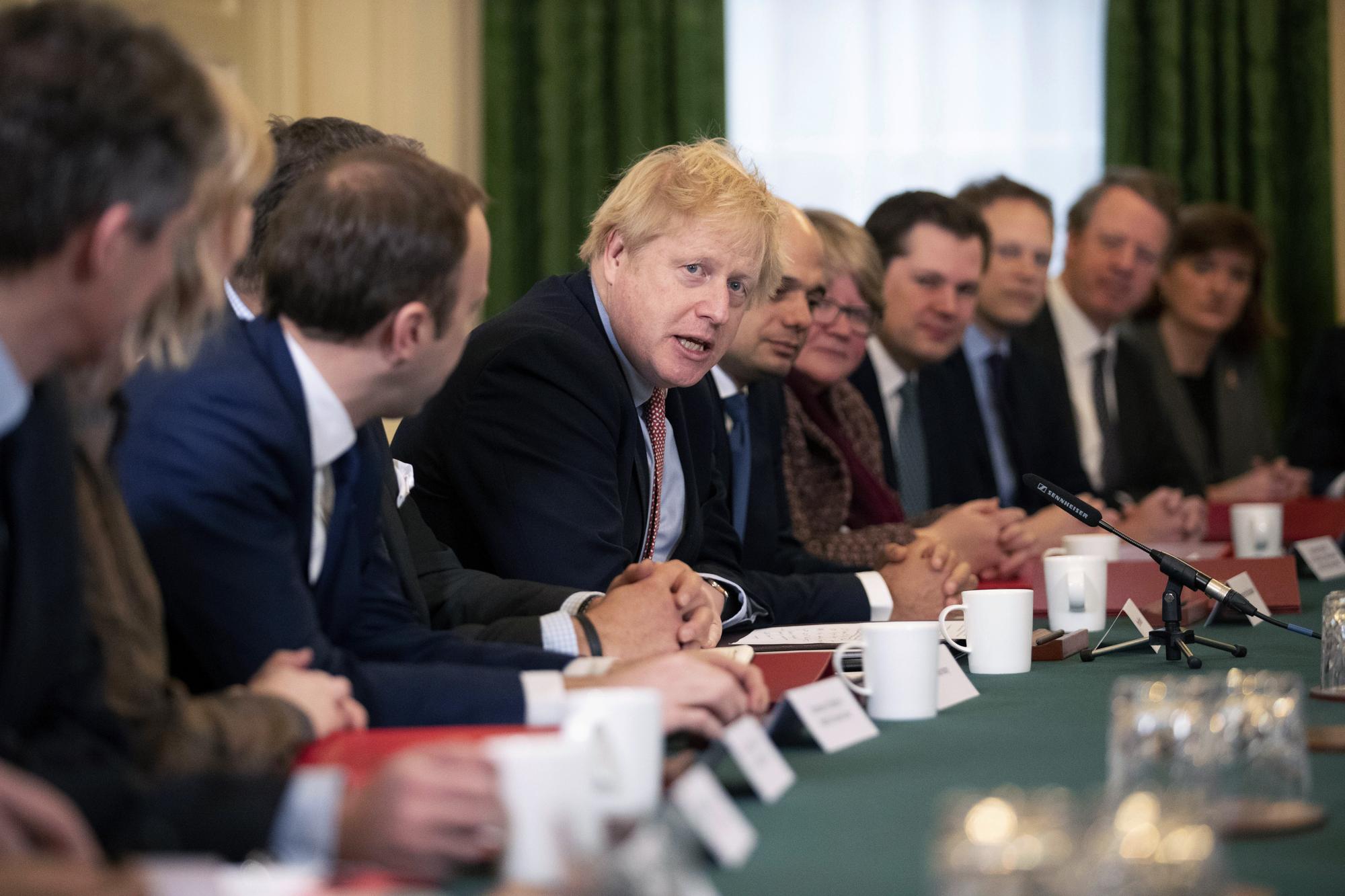 FILE - Britain's Prime Minister Boris Johnson speaks during his first cabinet meeting since the general election, inside 10 Downing Street in London, Tuesday, Dec. 17, 2019. He was the mayor who reveled in the glory of hosting the 2012 London Olympics, and the man who led the Conservatives to a whopping election victory on the back of his mission to ?get Brexit done.? But Boris Johnson?s time as prime minister was marred by his handling of the coronavirus pandemic and a steady stream of ethics allegations. (AP Photo/Matt Dunham, Pool, File)