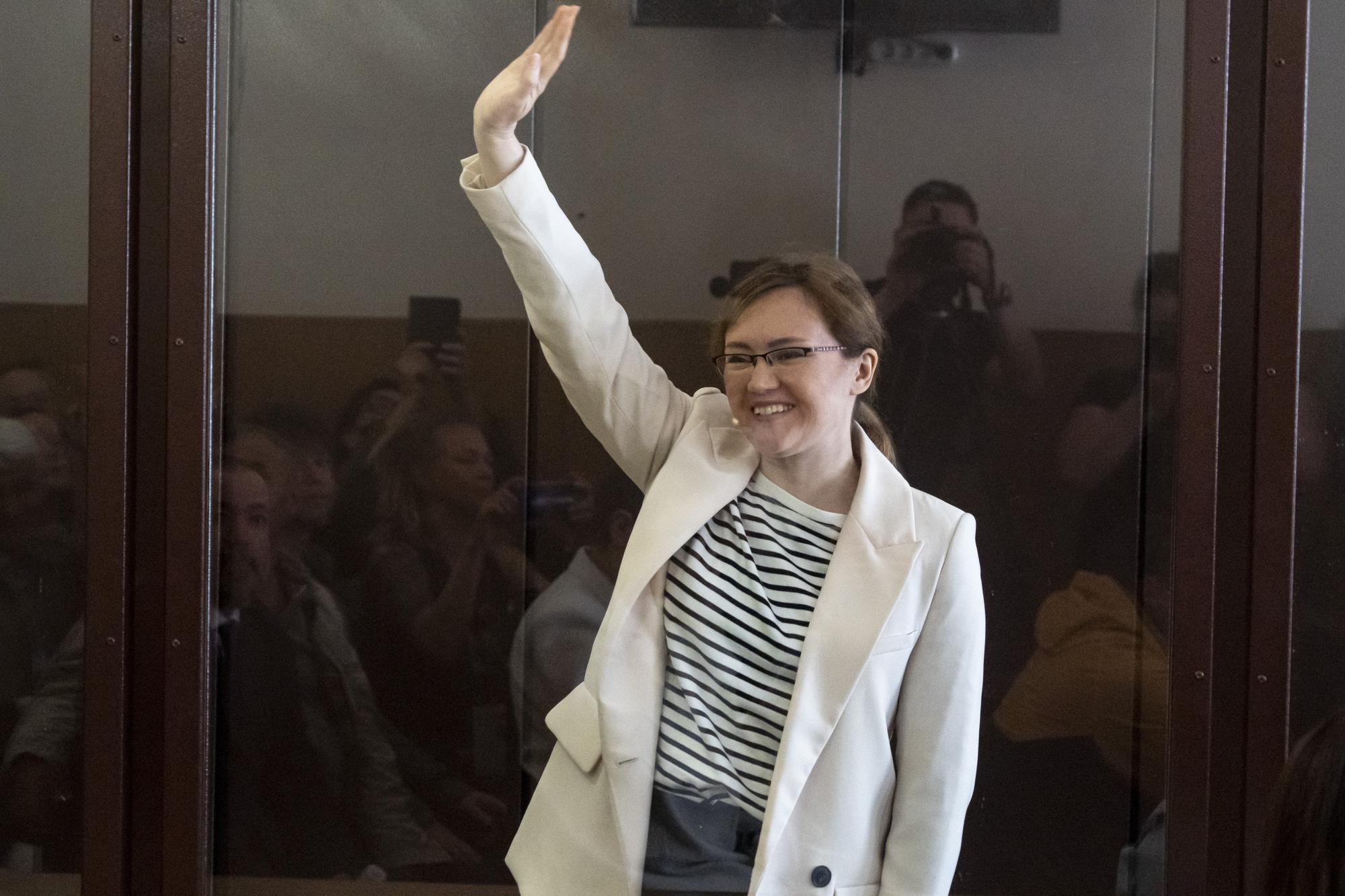 Lilia Chanysheva gestures as she is standing in a cage during a hearing in a courtroom of the Kirovskiy District Court in Ufa, Russia, Wednesday, June 14, 2023. Chanysheva, who used to head imprisoned opposition leader Alexei Navalny's office in the Russian region of Bashkortostan, was convicted of extremism charges and sentenced to 7.5 years in prison. The charges against Chanysheva, who was arrested in November 2021, stem from a court ruling made earlier that year that designated Navalny's Foundation for Fighting Corruption and his regional offices as extremist organizations. (AP Photo)
